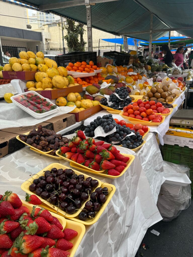 Vibrant fresh fruit display at a São Paulo street market.